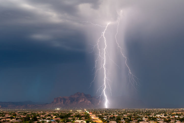 Dramatic lightning bolt from a storm over the superstition mountains in arizona