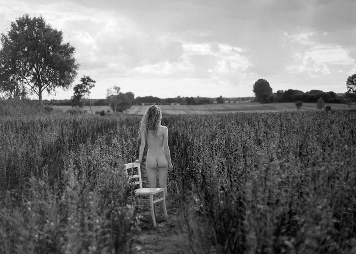 Woman on field against sky