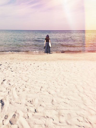 Rear view of woman on beach