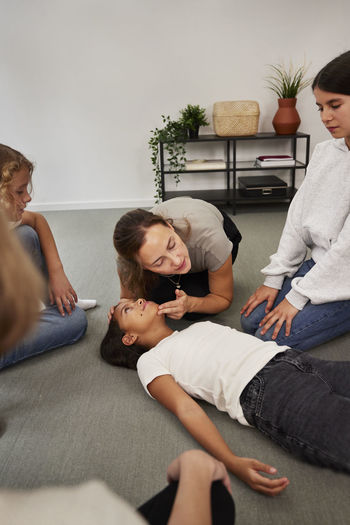 Teacher giving first aid training