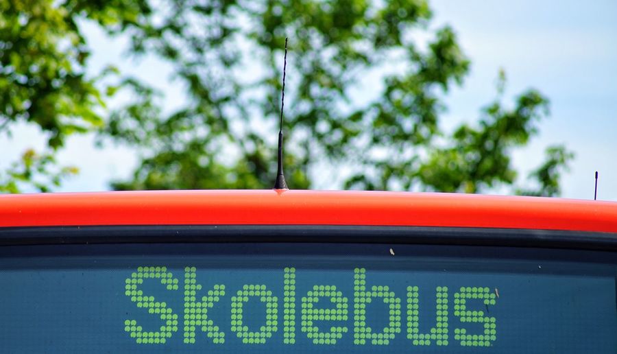 Low angle view of text on school bus