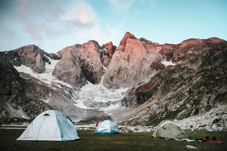 Tent on land against mountains