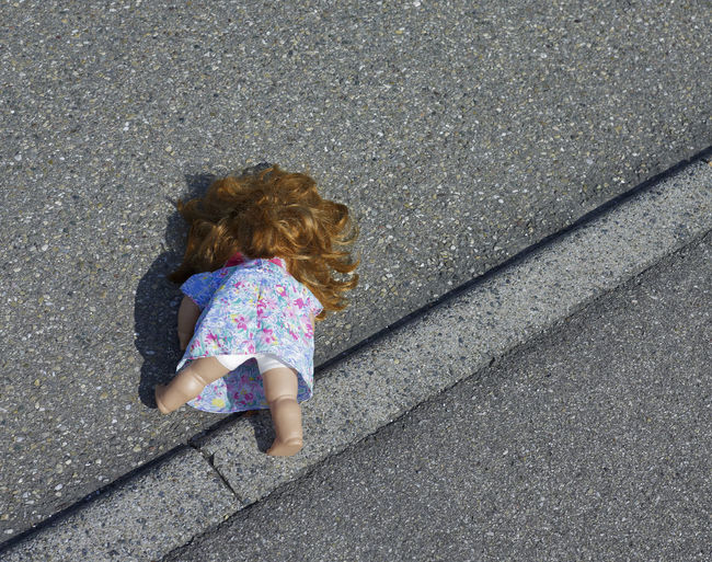 High angle view of doll on road
