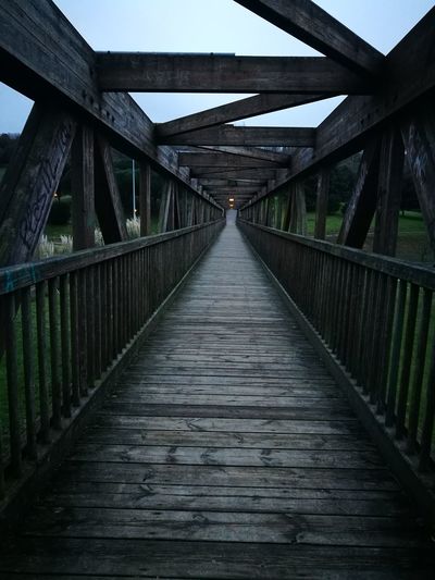 Wooden bridge against sky