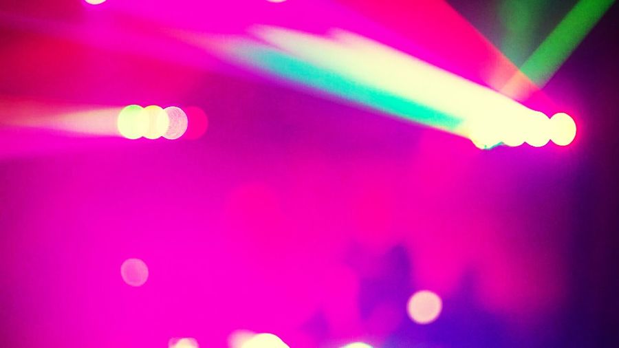 Defocused image of illuminated lights in nightclub