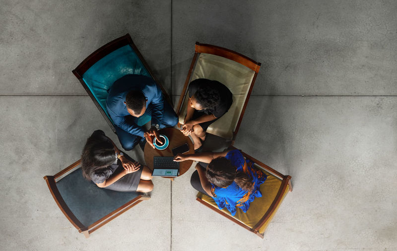 High angle view of people with toy on floor