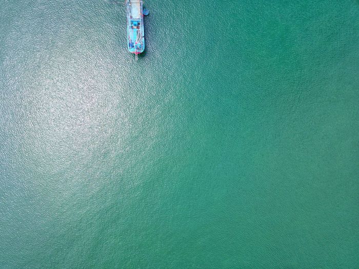 Ship alone on blue ocean