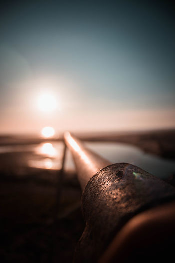 Close-up of sea against sky during sunset