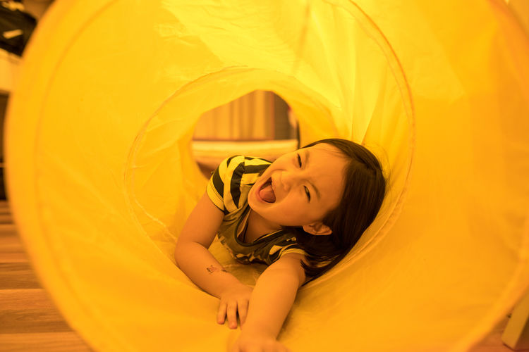 Portrait of smiling girl lying down