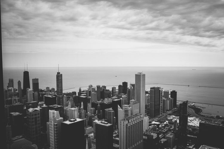 High angle view of sears tower and cityscape by sea against sky