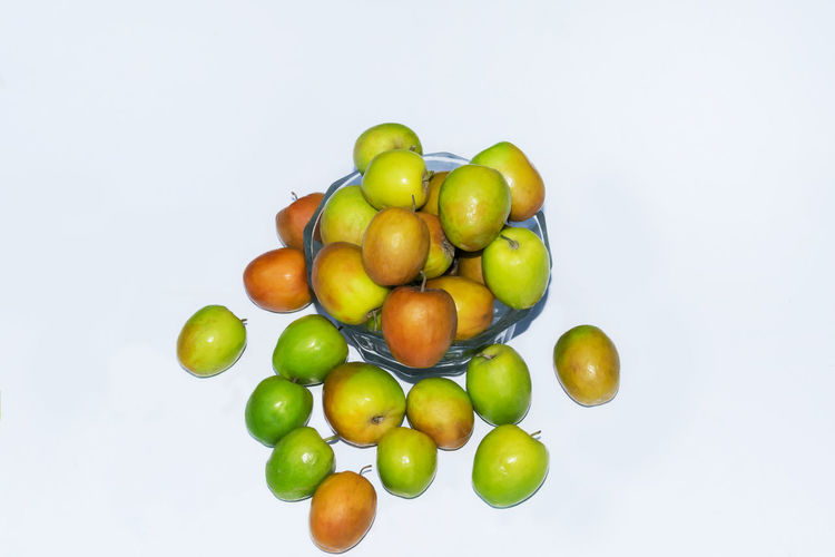 Directly above shot of apples on white background