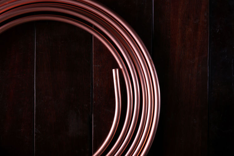 Directly above shot of coiled copper on table