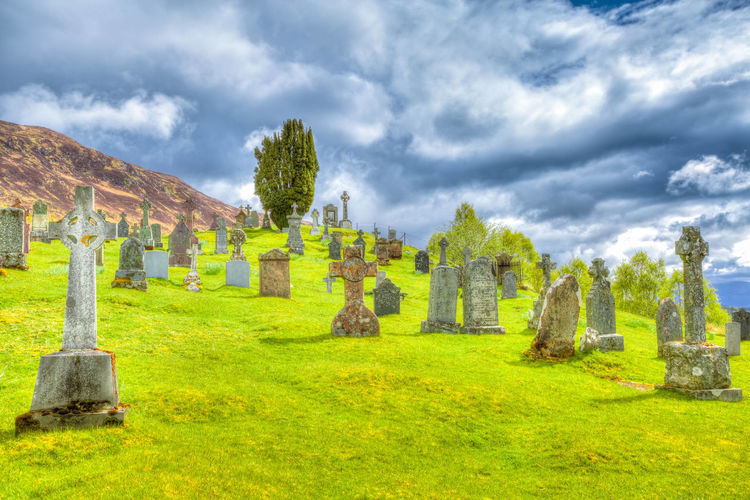 View of cemetery against cloudy sky