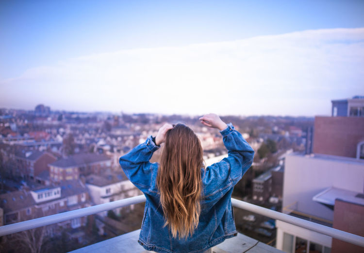 Rear view of woman at cityscape