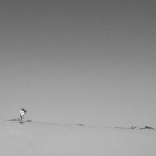 Man on snow against clear sky