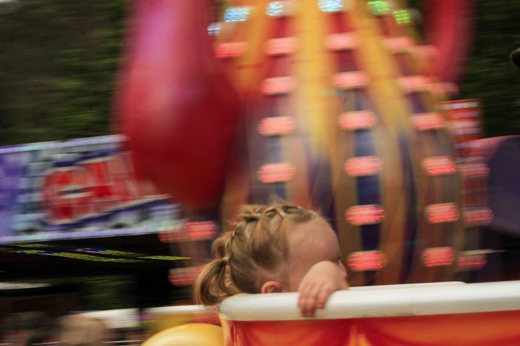 Blurred motion of woman in amusement park