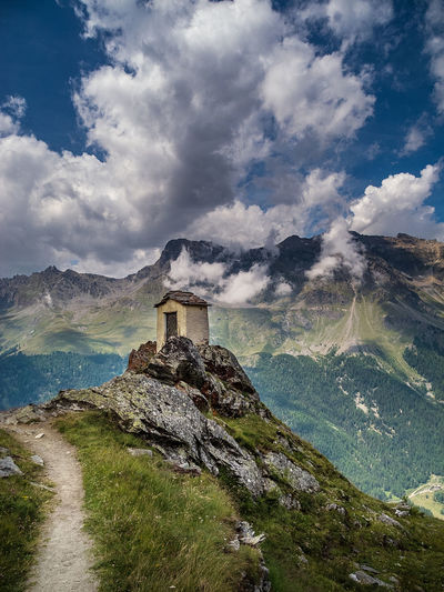 Built structure on mountain against sky