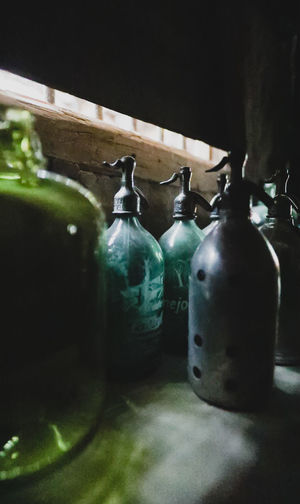 Close-up of old bottles on table