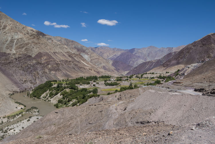 Scenic view of mountains against blue sky at ladakh
