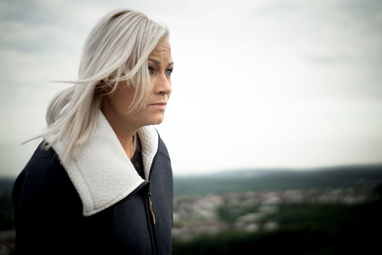 Thoughtful woman with white hair