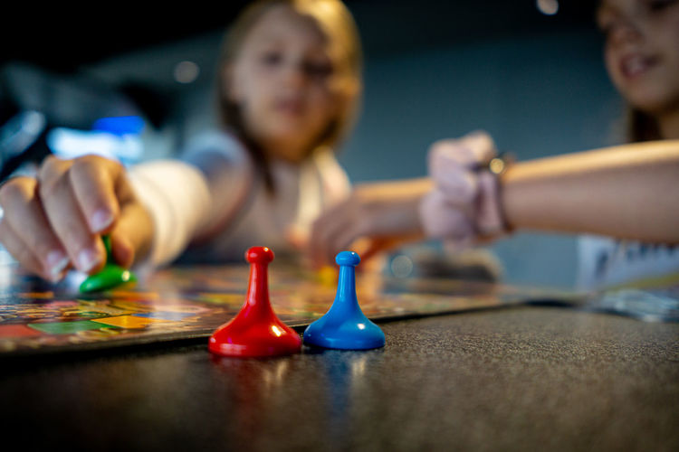 Close-up of girl playing with toy on table