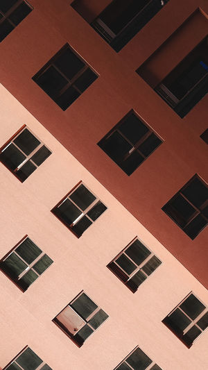 Tilted view of  windows and balconies on a building 
