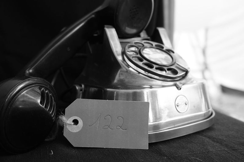 Close-up of rotary phone on table