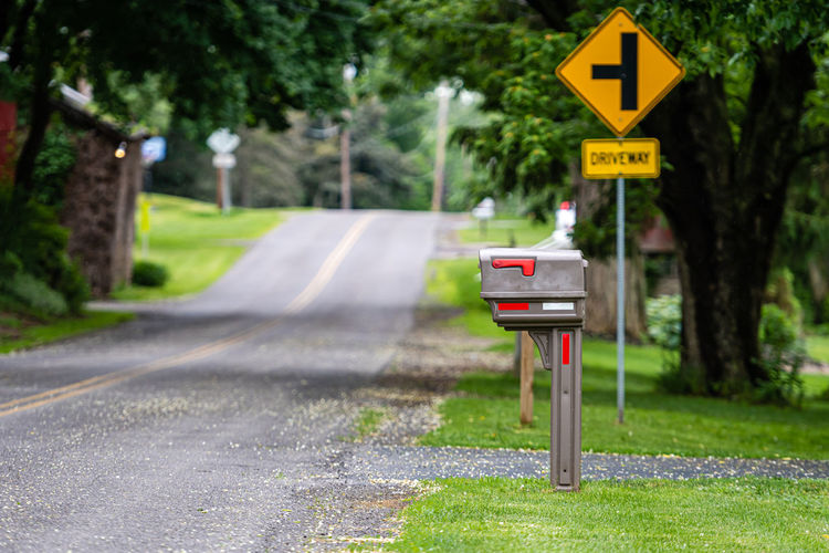 A traditional american mailbox on the side of a village road