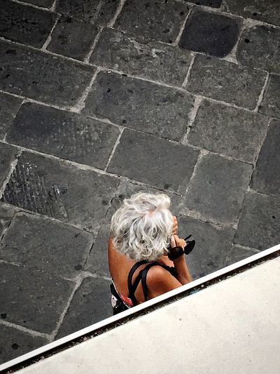 High angle view of a woman with grey hair