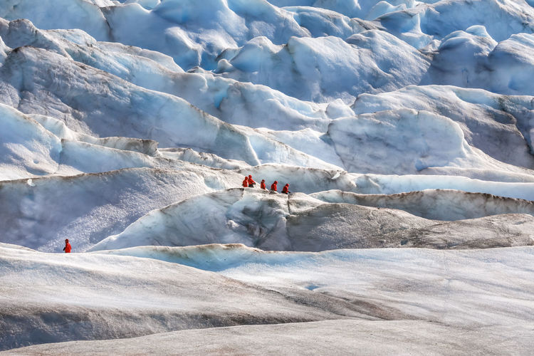 People on glacier during winter