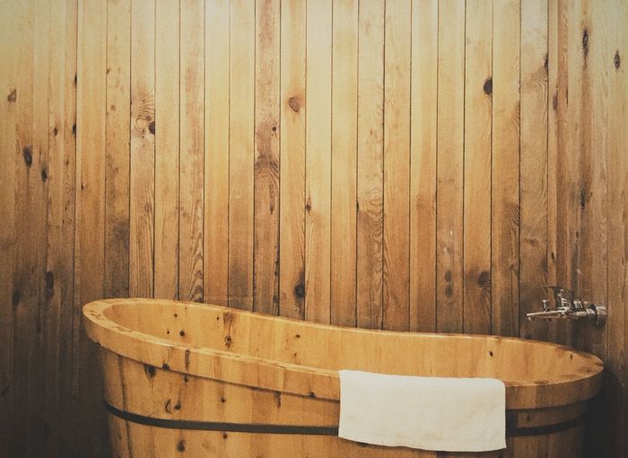 High angle view of wooden bathtub in bathroom