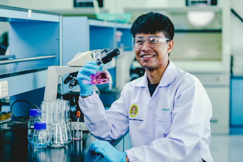 Portrait of young male scientist working in laboratory
