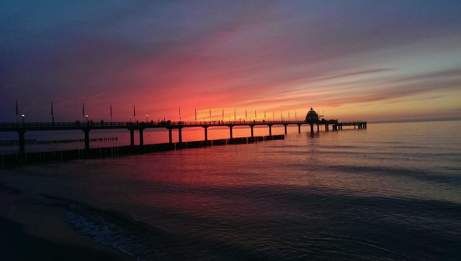 Silhouette of pier at sunset