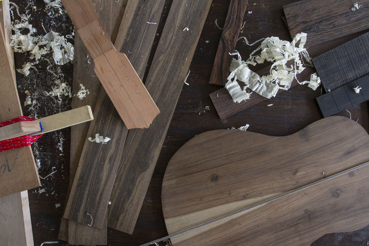 High angle view of wooden planks on table at carpentry workshop