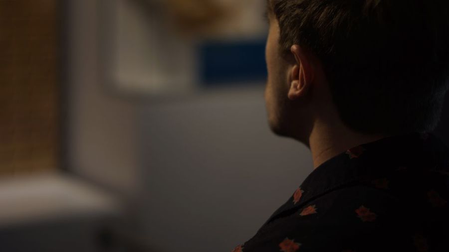 Midsection of man in darkroom