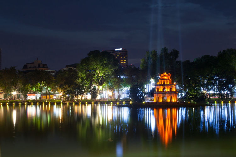 Illuminated buildings in water