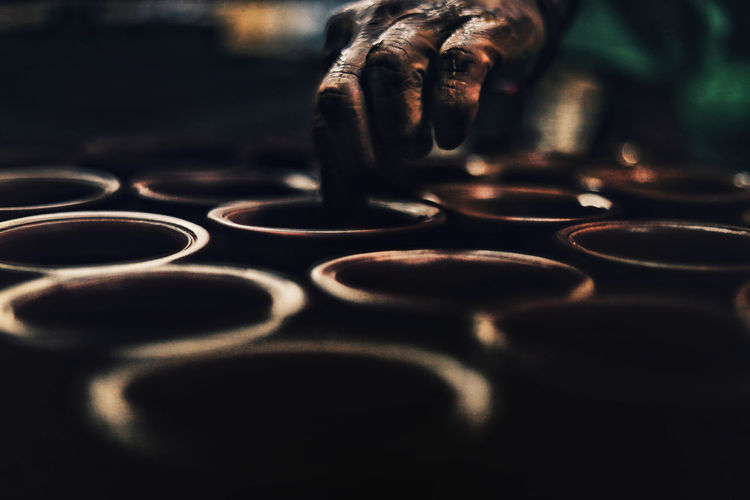 Close-up of human hand making pots