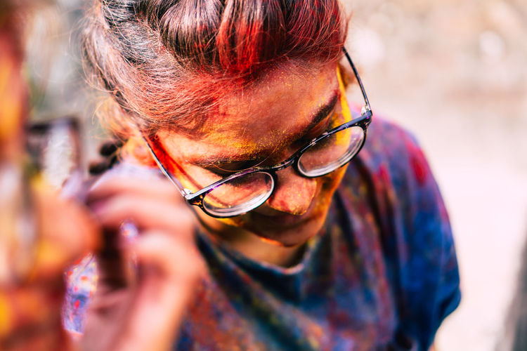 Close-up of woman covered with powder paint