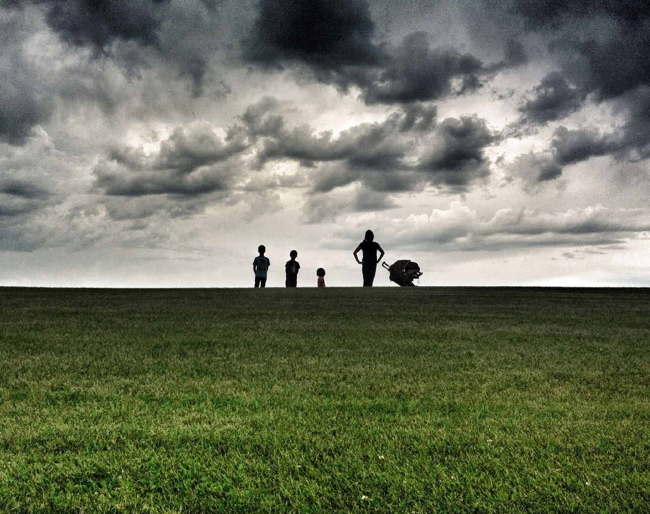 sky, togetherness, men, cloud - sky, leisure activity, lifestyles, grass, bonding, tranquil scene, tranquility, nature, sea, horizon over water, beauty in nature, scenics, cloudy, water, friendship
