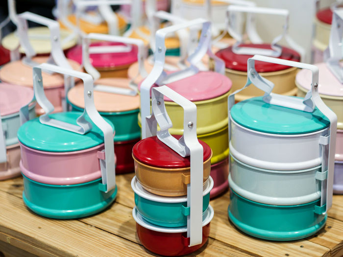 Multi colored lunch boxes on table