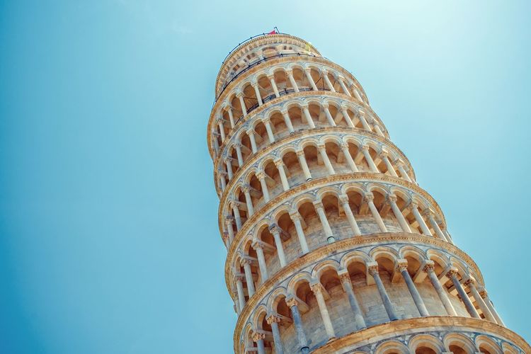 Low angle view of leaning tower of pisa against sky