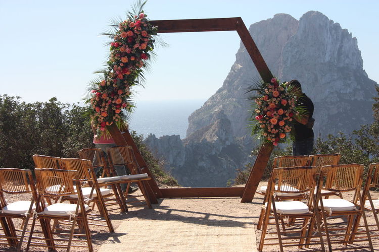 Chairs and tables against clear sky