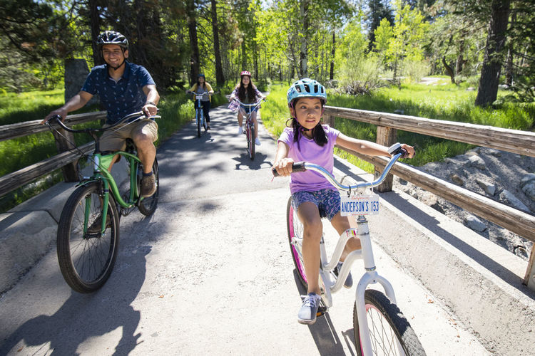 A family enjoys a bike ride on a bike path in south lake tahoe, ca