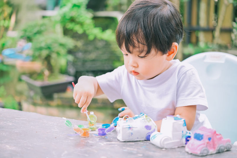 Cute boy playing with toy