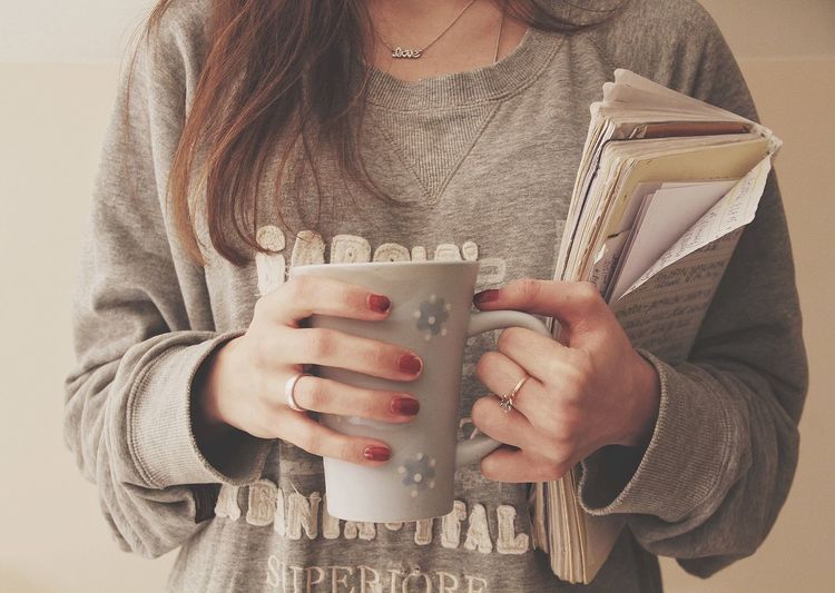 Close-up of hand holding mug