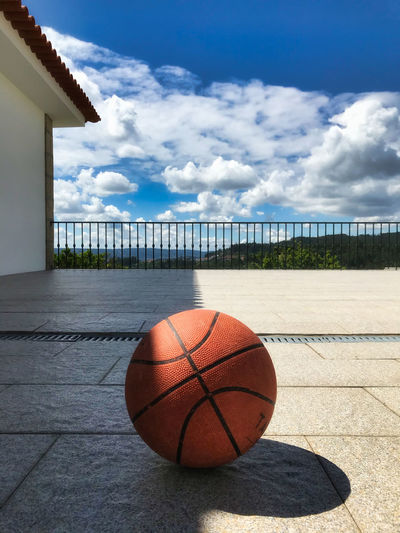 Basketball hoop against sky on sunny day