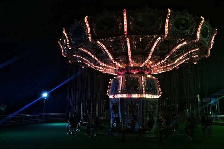 Low angle view of firework display at night