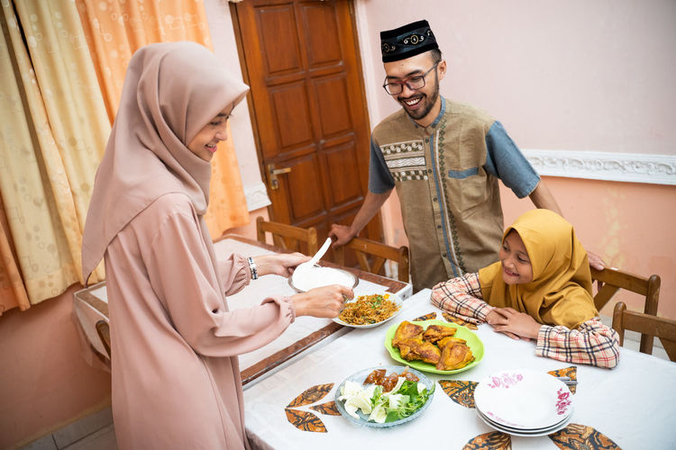 Happy family celebrating eid at home