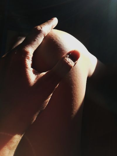 Close-up of woman hand with sunlight