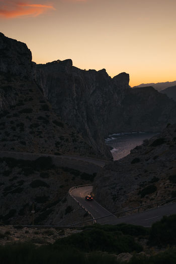 Scenic view of mountains against sky during sunset